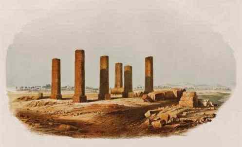 Six broken columns and some rubble stand in a field, all that remain of Amara West.