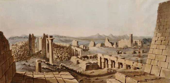 Karnac is a  vast plain filled with columns and blocks, some standing, some tumbled.